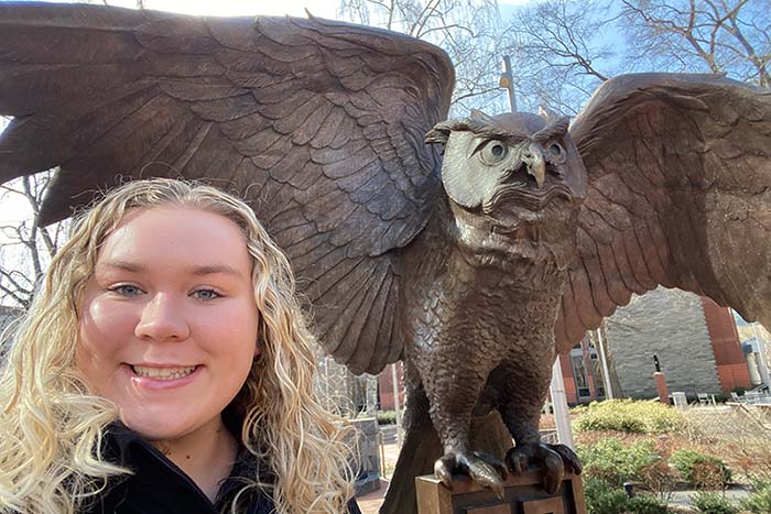 Girl taking a selfie with Temple Owl